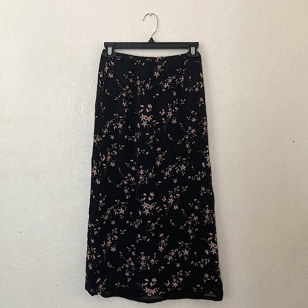 Black skirt with flowers.